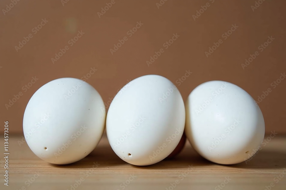 small white quail eggs displayed wooden surface empty space around