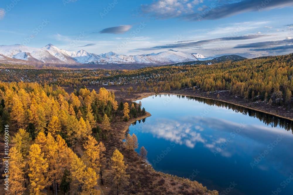 Naklejka premium Capturing stunning Altai mountains in fall, tranquil lake reflecting vibrant foliage and serene nature.