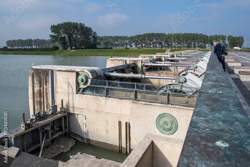 Hydraulic dam on the Couesnon river at Mont Saint-Michel in Normandy, France photo