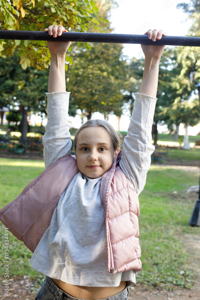 Funny child girl on playground. Kids play outdoor. Childhood, happiness and leisure activity concept Funny child girl on playground. Kids play outdoor. Childhood, happiness and leisure activity concept