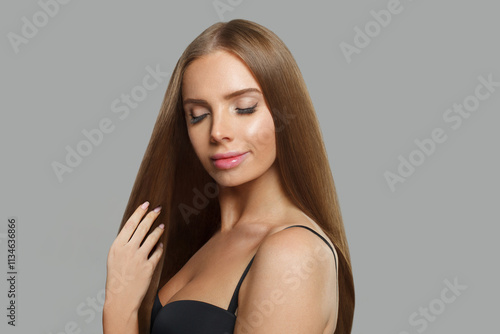 Wallpaper Mural Cute young woman model with modern make-up and long straight smooth hairstyle standing on white studio background Torontodigital.ca