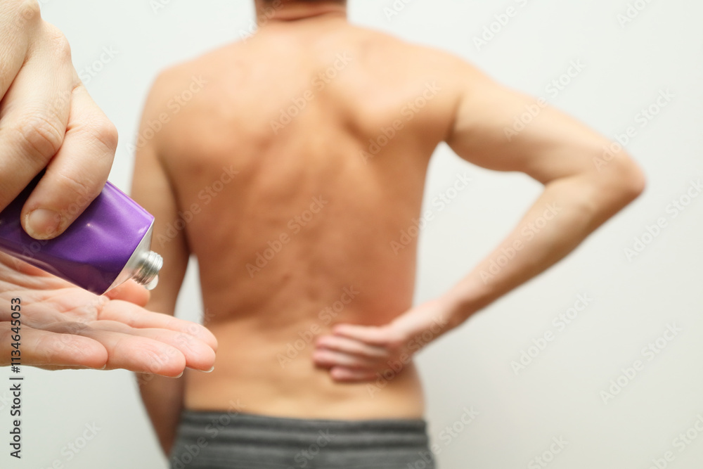 Naklejka premium Male holding hand to point of back pain. Senior man having back pain. Back pain treatment. Pain relief and health care concept.