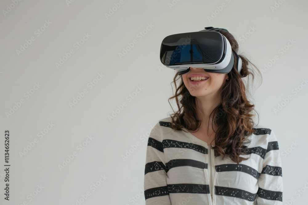 Young Woman Enjoying Virtual Reality Experience with Headset on a Light Background, Expressing Joy and Excitement Through Modern Technology Interaction Young Woman Enjoying Virtual Reality Experience with Headset on a Light Background, Expressing Joy and Excitement Through Modern Technology Interaction