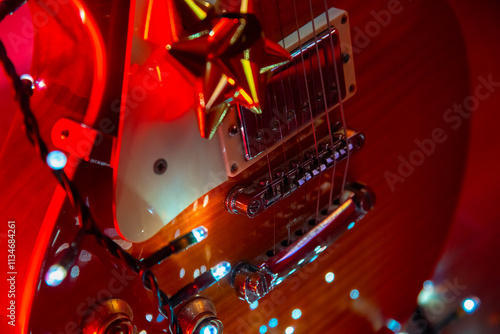 Close up of a guitar with Christmas decorations