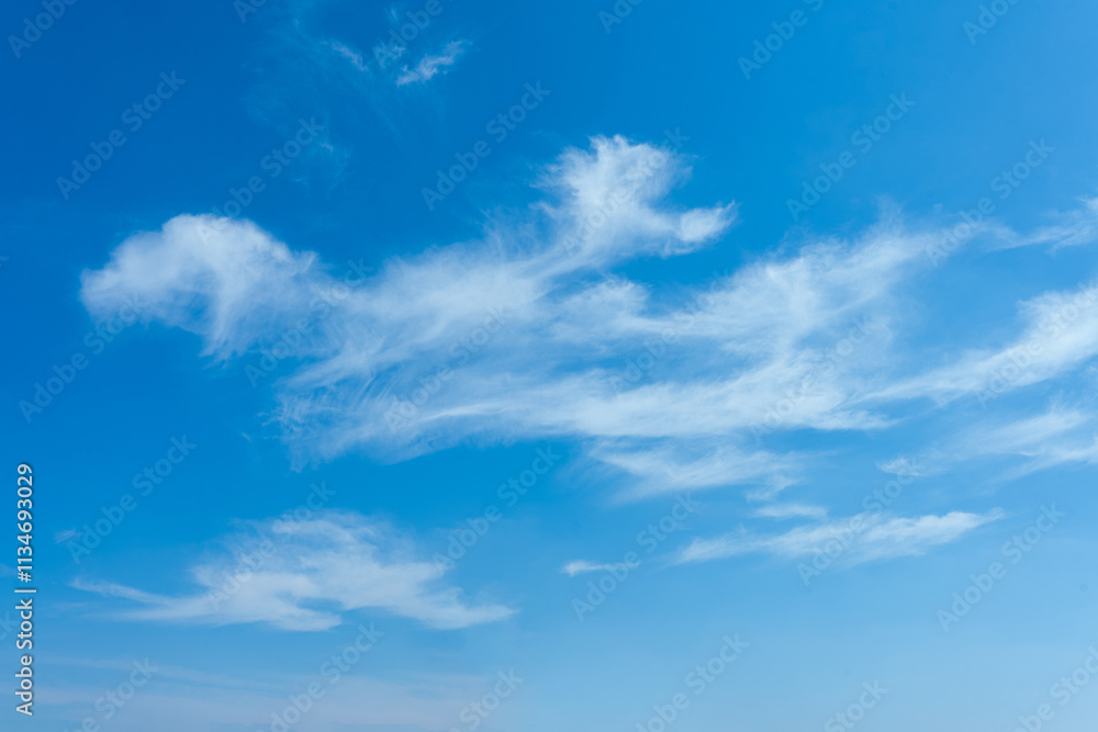 Fototapeta premium Serene Blue Sky with Wispy Cirrus Clouds Nature Background