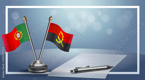 Portugal and Angola National flags on small table with bokeh background, cooperative relationship