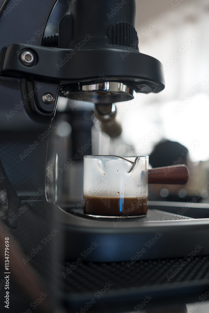 Barista makes an Espresso shot. Close up Barista makes an Espresso shot. Close up