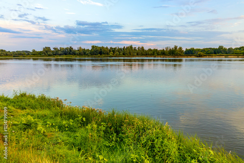 Fotografie Vistula river landscape at summer early evening with riverside with wild beaches