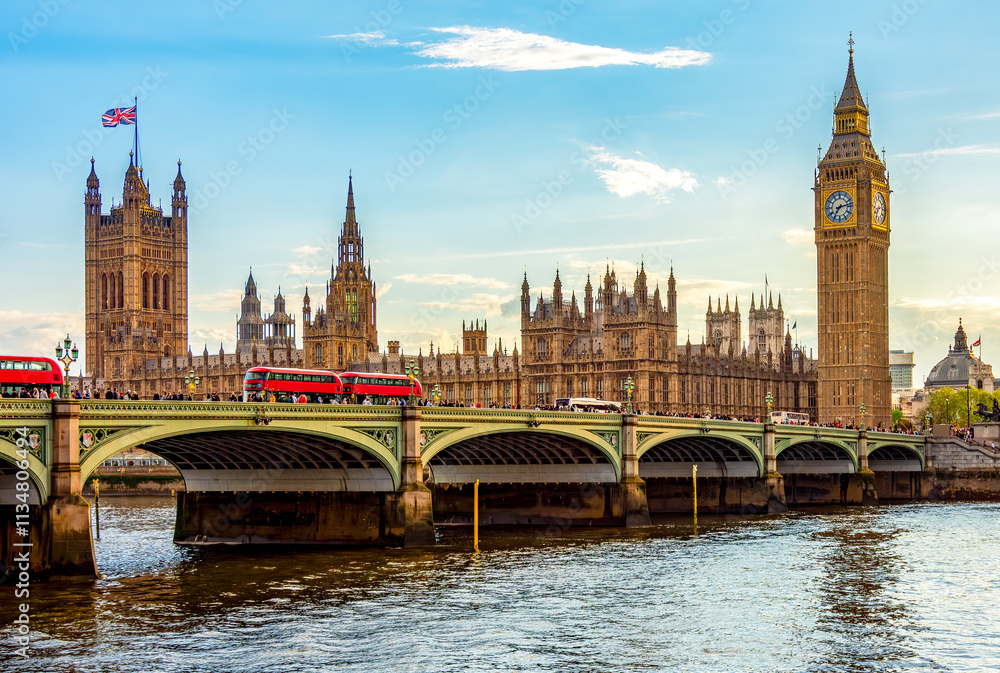 Houses of Parliament with Big Ben tower and Westminster bridge at sunset, London, UK