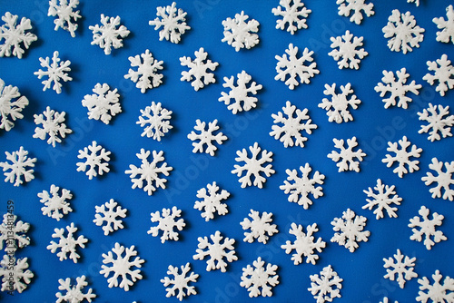 Close-up of unique snowflakes on blue