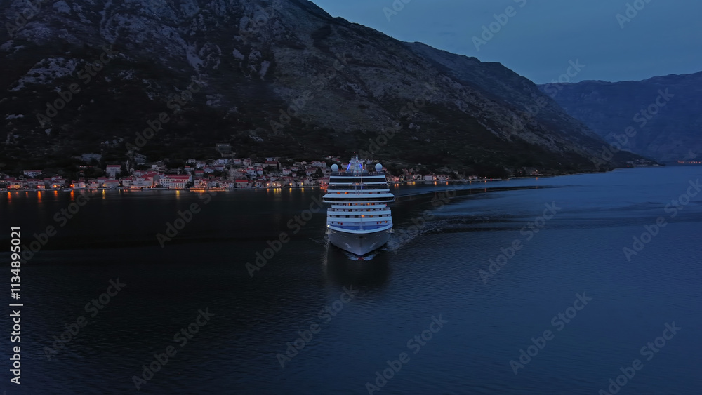 Naklejka premium Cruise ship in Kotor Bay at night