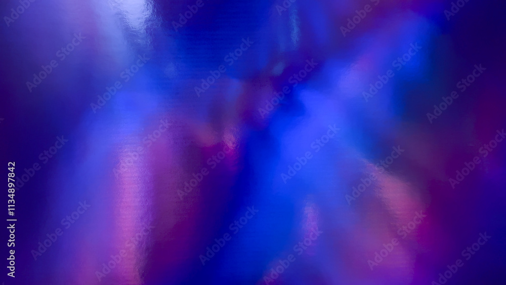 top shot of abstract pastel iridescent holographic foil background with light leaks. holo purple holo flat foil material. cool glitter surface with shiny rainbow feel. top shot of abstract pastel iridescent holographic foil background with light leaks. holo purple holo flat foil material. cool glitter surface with shiny rainbow feel.