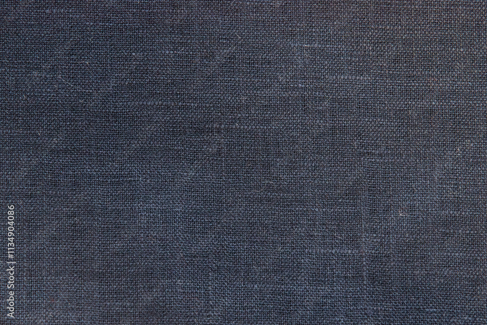 Dark navy color linen fabric texture closeup as textile background Dark navy color linen fabric texture closeup as textile background