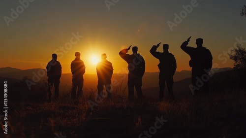 Silhouettes of soldiers saluting the sunset with the USA flag, paying tribute to all who served. photo