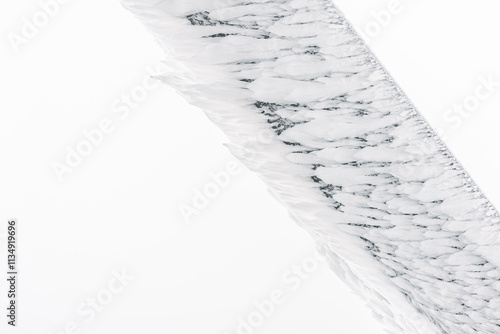 Obraz na płótnie Winter landscape, white frost on a wooden beam of elongated shape from the blowing wind. w salonie