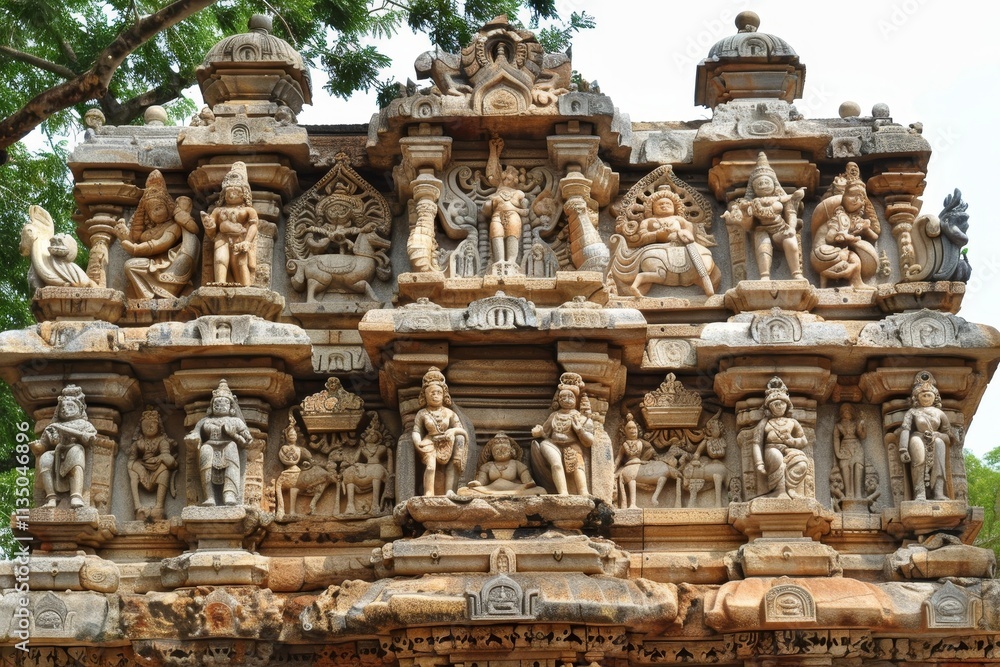 An ornate stone temple features elaborate carvings of Hindu deities and intricate sculptures, surrounded by vibrant greenery in a serene setting. An ornate stone temple features elaborate carvings of Hindu deities and intricate sculptures, surrounded by vibrant greenery in a serene setting.
