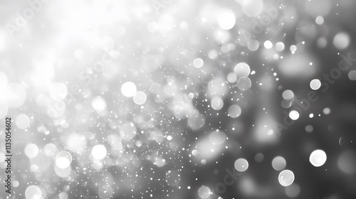An abstract background of white and gray bokeh lights with motion blur.