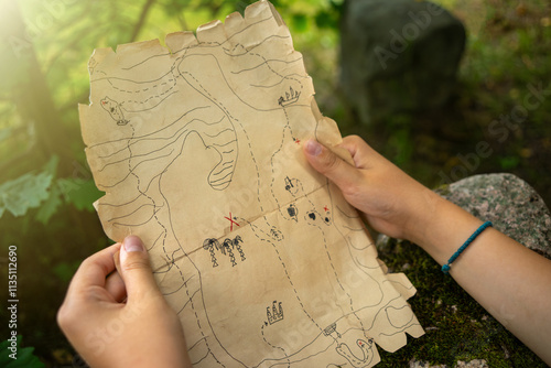 A treasure map for children with drawn symbols and lines. An outdoor quest with the search for pirate treasures.