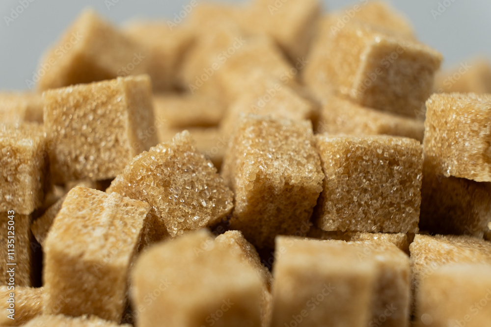 Macro cubes of brown cane unrefined demerara sugar. Macro cubes of brown cane unrefined demerara sugar.