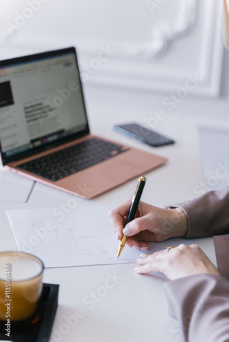 Obraz na płótnie European business woman CEO working on laptop sitting at table workspace, making notes in office. w salonie