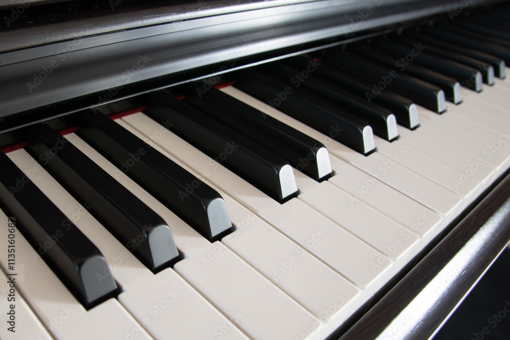 Piano with white and black keys inside the studio. Piano with white and black keys inside the studio.