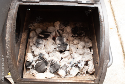 Charcoal ready to cook food in a small grill