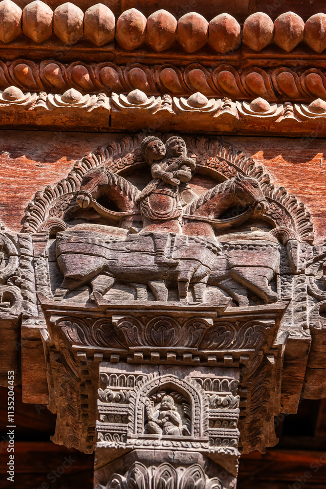 Fototapeta premium Wooden carved detail of an ancient building in Bhaktapur, Kathmandu valley, Nepal. Architectural detail.
