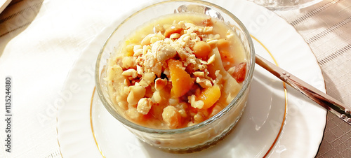 Ashure dessert with legumes and dried fruits named aşure or asure . Noah’s pudding in the bowl. photo