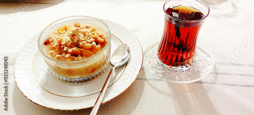 Ashure dessert with legumes and dried fruits named aşure or asure . Noah’s pudding in the bowl. photo