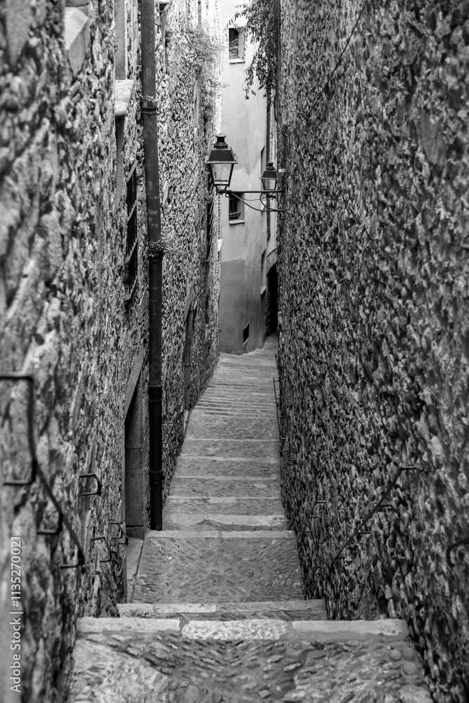 Beautiful streets of Girona old town with ancient buildings and cobblestone stairways, Spain Beautiful streets of Girona old town with ancient buildings and cobblestone stairways, Spain