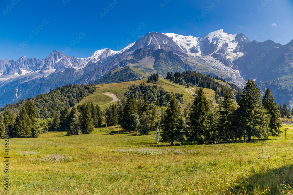 Fototapeta premium Mont Blanc, Monte Bianco mountain summit in the Alps. The highest mountain in Europe. Snow and glacier covered high altitude snow mountain in the Alps. The top of Montblanc Chamonix valley landscape
