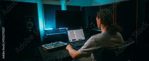 Schilderij op canvas A male sound engineer in a home recording studio