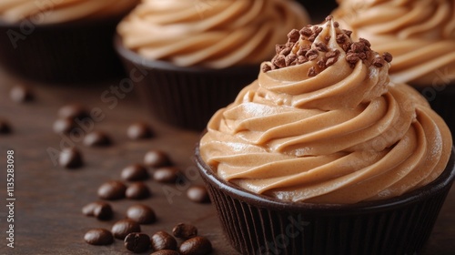 Delicious coffee flavored cupcakes with smooth frosting and chocolate sprinkl...