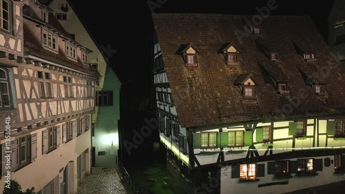 Old half-timbered house, Schiefes Haus Aerial Night Drone Shot in the Fischerviertel in Ulm, Baden-Wurttemberg, Germany photo