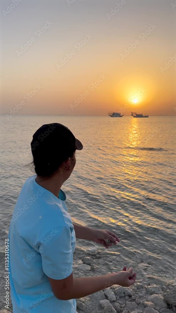 Woman holds stone ready to skip across water sunset paints sky golden creating peaceful scene quiet connection with nature captures simple joy of moment at waters edge tranquil and reflective Woman holds stone ready to skip across water sunset paints sky golden creating peaceful scene quiet connection with nature captures simple joy of moment at waters edge tranquil and reflective