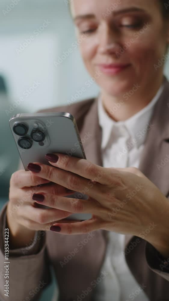 Caucasian businesswoman sits at the workplace, chats with business partner or customer using mobile phone. Female marketing manager or financial specialist works in modern office. E-commerce concept. Caucasian businesswoman sits at the workplace, chats with business partner or customer using mobile phone. Female marketing manager or financial specialist works in modern office. E-commerce concept.