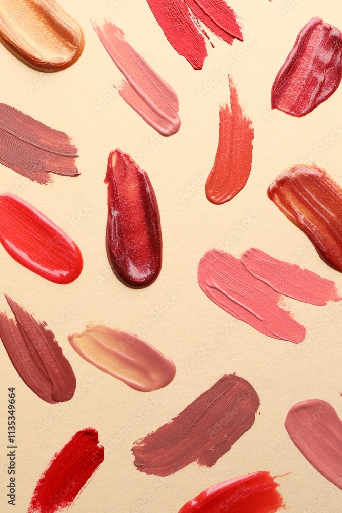 Samples of different lip products on beige background, top view Samples of different lip products on beige background, top view