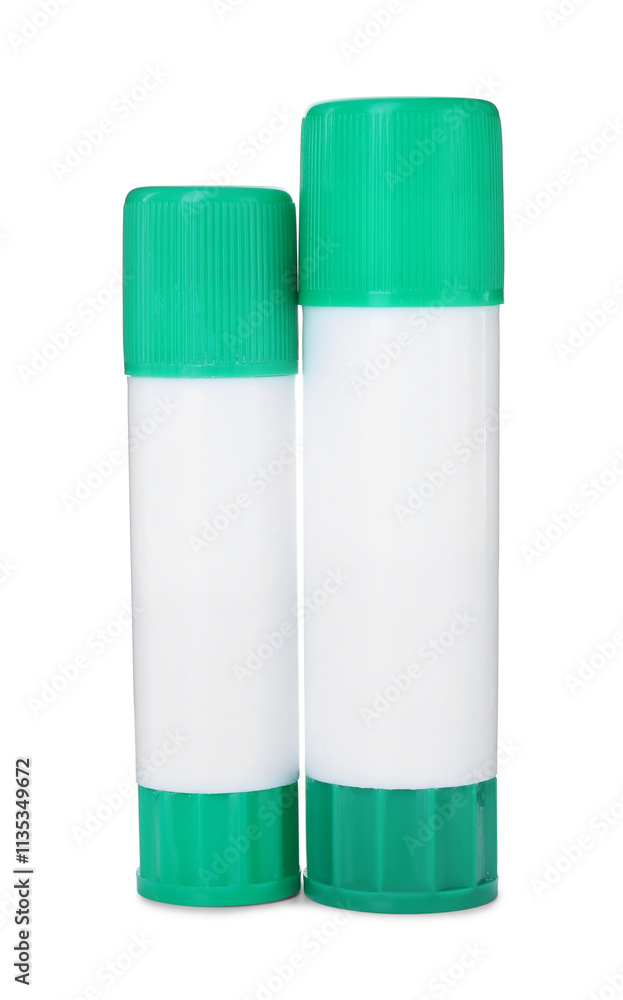 Two glue sticks with caps isolated on white Two glue sticks with caps isolated on white
