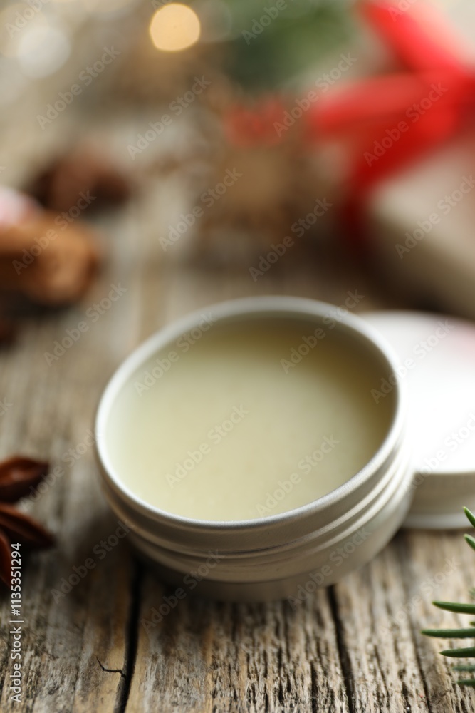 Natural solid perfume in container on wooden table, closeup Natural solid perfume in container on wooden table, closeup