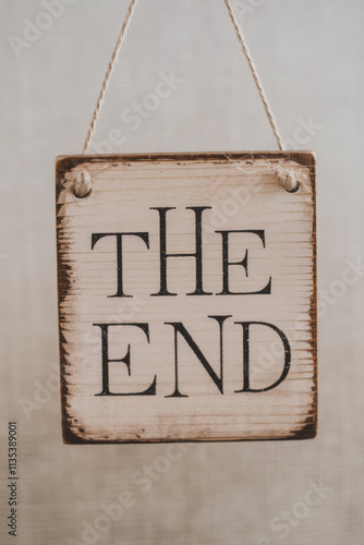 Decorative wooden sign with burned the end message. Rustic denouncement text perfect for movie documentary and content creation with the end typography. photo