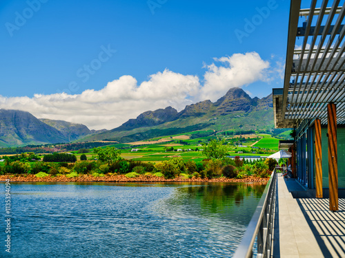 Obraz na płótnie Balcony overlooking a dam with Helderberg Mountain and vineyards on the slope, Somerset West, South Africa w salonie