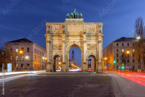 The illuminated Siegestor (Victory Gate) in Munich, Germany, photographed at night. photo