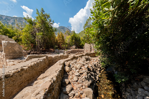 The ancient city of Olympos is a Lycian settlement located 10 km north of Tahtalı Mountain in Kumluca District, west of Antalya. It was founded as a Lycian port city. It is an important tourism locati photo