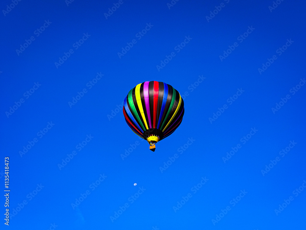 Colorful Hot Air Balloon Floating in the Clear Blue Sky Colorful Hot Air Balloon Floating in the Clear Blue Sky