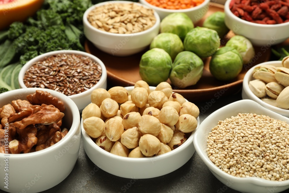 Superfood. Different healthy food products on grey table, closeup Superfood. Different healthy food products on grey table, closeup