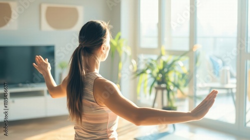Woman practicing yoga in a sunlit room Free Download Woman practicing yoga in a sunlit room - GFXLoad
