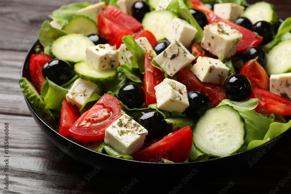 Delicious salad with feta cheese on wooden table, closeup Delicious salad with feta cheese on wooden table, closeup