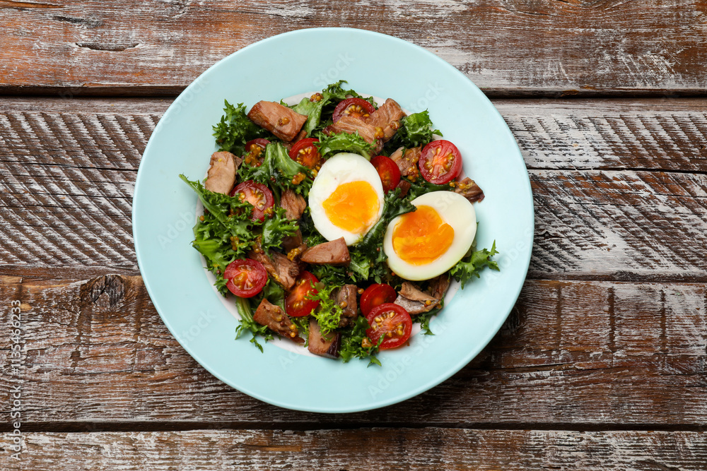 Delicious fresh tuna salad on wooden table, top view Delicious fresh tuna salad on wooden table, top view
