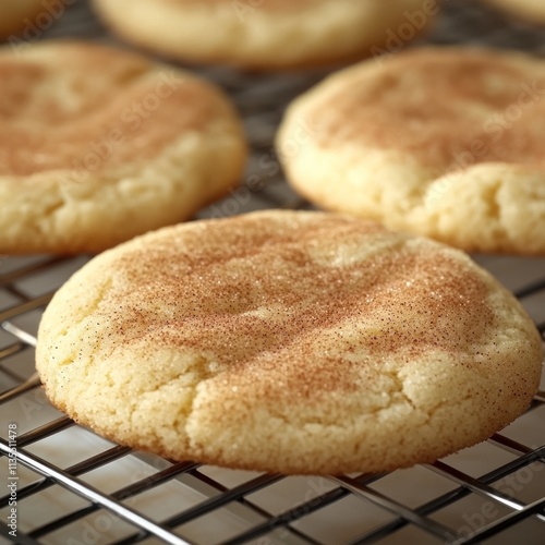 Freshly baked snickerdoodle cookies cooling on a wire rack. photo