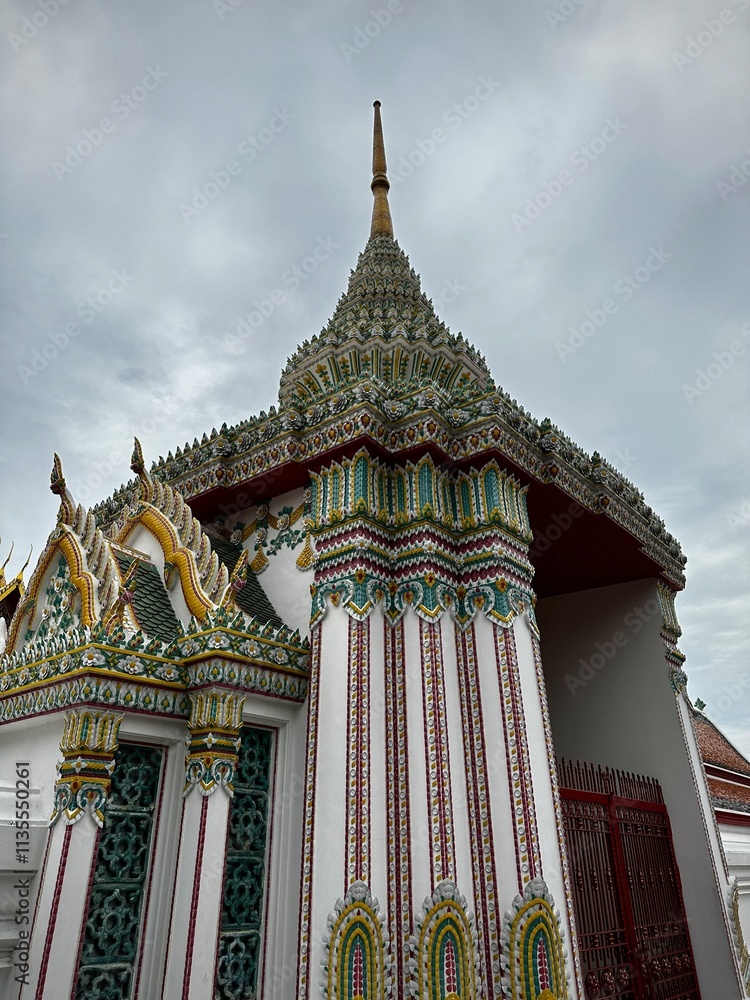 Fototapeta premium Colorful tile work on a white building (Grand Temple, Bangkok, Thailand)